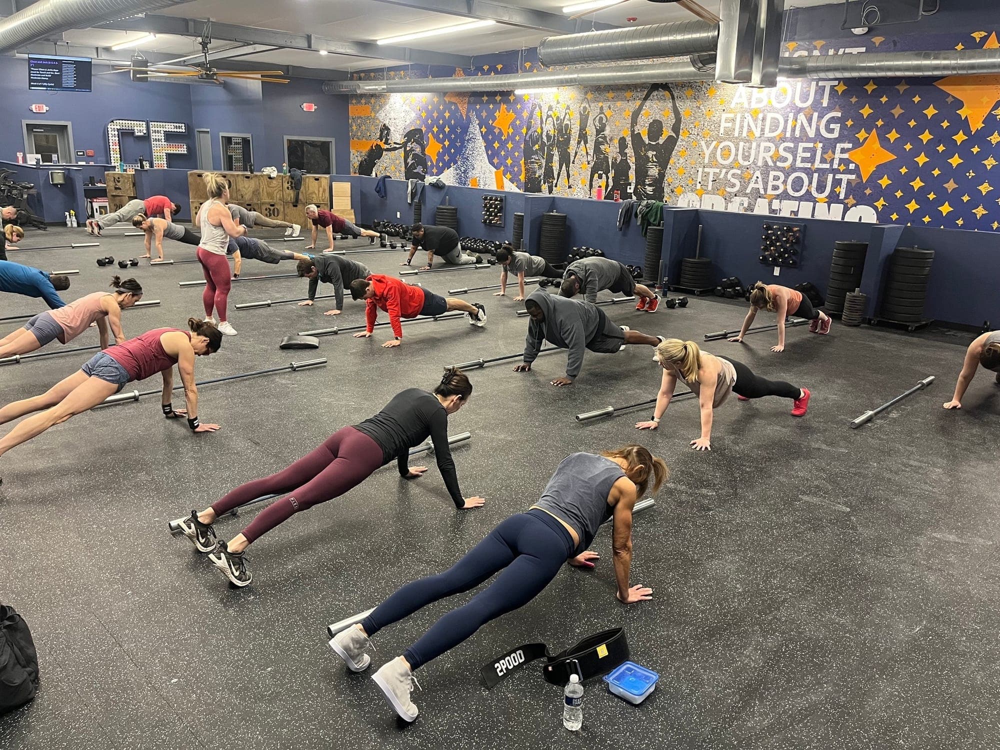 Group class training together on the gym floor