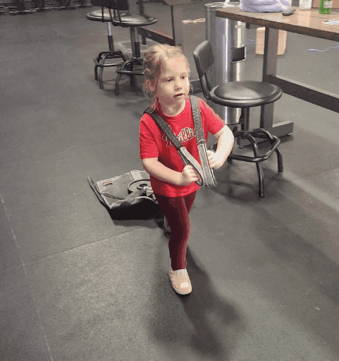 Kids practicing movement technique with a coach at CrossFit Main Line